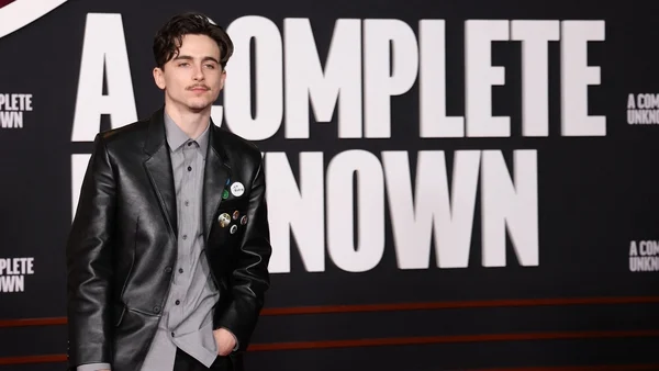 Timothée Chalamet channels Bob Dylan at biopic premiere